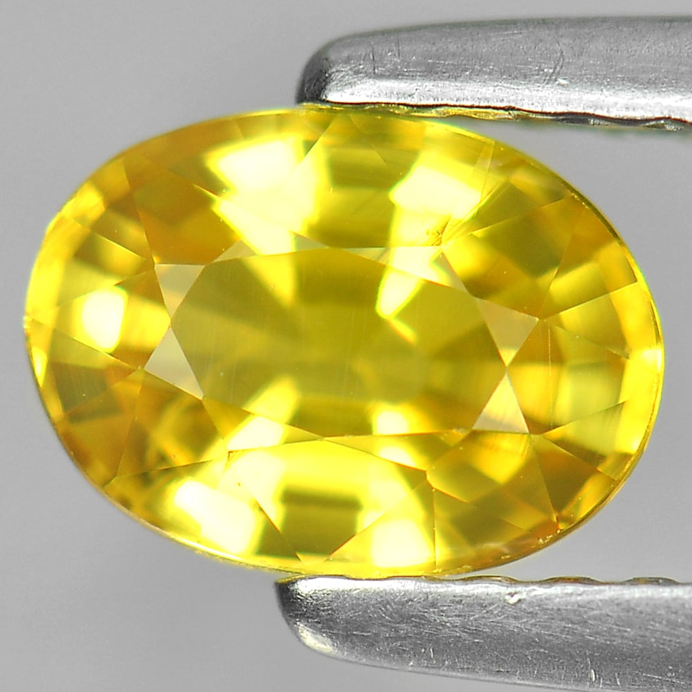 Natural Yellow Sapphire Gemstones 1.06 Ct. Oval Shape 6.8 x 5 Mm.: Product ID: 806150917 Product Name: Natural Yellow Sapphire Weight: 1.06 CT. Size: 6.8 x 5 x 3.6 MM. Shape: Oval Color: Yellow Clarity:VS Luster: Very Good Gems Origin: Thailand Treatment: Heated Crys