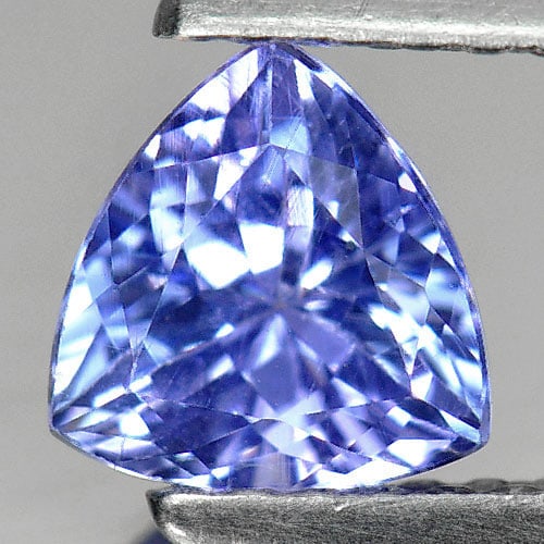 Natural Violetish Blue Tanzanite Gemstones 0.81 Ct. Trilliant Shape 5.9 Mm.: Product ID: 807004649 Product Name: Natural Tanzanite Weight: 0.81 CT. Size: 5.9 x 5.9 x 3.8 MM. Shape: Trilliant Color: Violetish Blue Clarity:VS Luster: Very Good Gems Origin: Tanzania Treatment: He