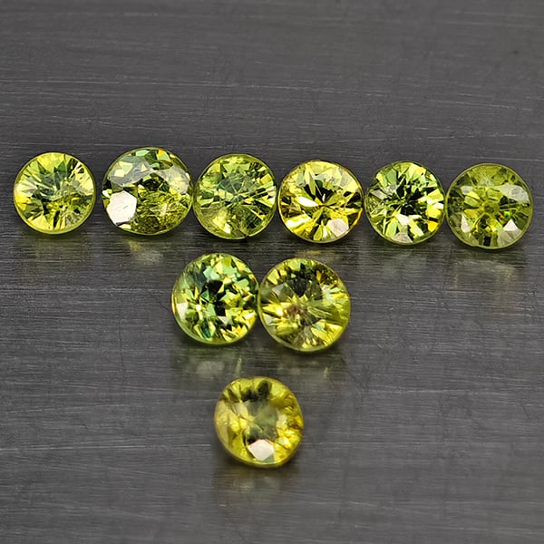 Natural Green Demantiod Garnet Gemstones 0.61 Ct. 9 Pcs. Round Diamond Cut 2.6 Mm.: Product ID: 802937776 Product Name: Natural Demantoid Weight: 0.61 CT. Size: 2.6 x 2.6 x 2 MM. Shape: Round Diamond Cut Color: Green Clarity:SI1 Luster: Good Gems Origin: Madagascar Treatment: Unheate