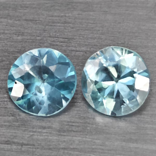 Natural Baby Blue Zircon Gemstones 0.96 Ct. 2 Pcs. Round Diamond Cut 4.7 Mm.: Product ID: 807743222 Product Name: Natural Zircon Weight: 0.96 CT. Size: 4.7 x 4.7 x 3 MM. Shape: Round Diamond Cut Color: Baby Blue Clarity:SI1 Luster: Good Gems Origin: Cambodia Treatment: Heated C
