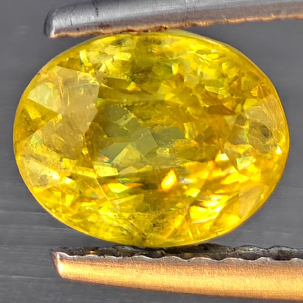 Natural Multi-Color Sphene Gemstones With Rainbow Spark 1.60 Ct. Oval Shape 7.6 x 6.1 Mm: Product ID: 806509112 Product Name: Natural Sphene Weight: 1.60 CT. Size: 7.6 x 6.1 x 4.6 MM. Shape: Oval Shape Color: Multi-Color Clarity:SI1 Luster: Good Gems Origin: Madagascar Treatment: Unheated 