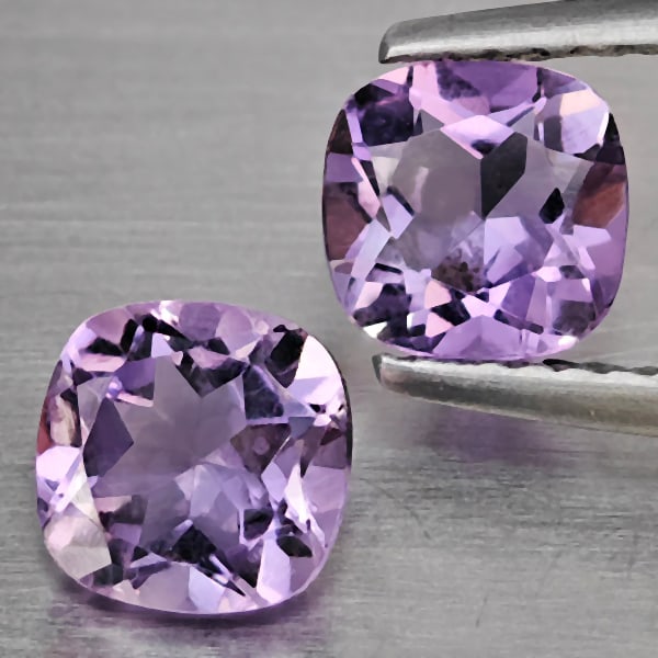 Natural Purple Amethyst Gemstones 1.61 Ct. 2 Pcs. Cushion Shape 6.1 Mm.: Product ID: 800325560 Product Name: Natural Amethyst Weight: 1.61 CT. Size: 6.1 x 6.1 x 3.8 MM. Shape: Cushion Shape Color: Purple Clarity:VSI Luster: Good Gems Origin: Brazil Treatment: Unheated Crys