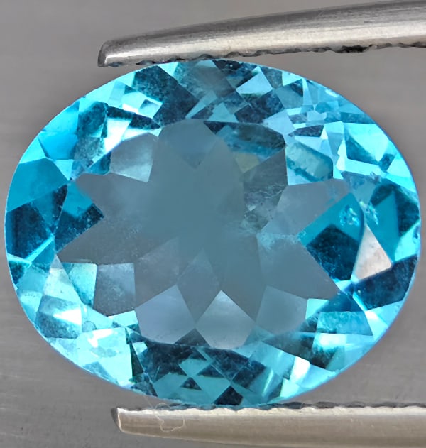 Natural Swiss Blue Topaz Gemstones 4.72 Ct. Oval Shape 12.2 x 10.1 Mm.: Product ID: 807169027 Product Name: Natural Blue Topaz Weight: 4.72 CT. Size: 12.2 x 10.1 x 5.3 MM. Shape: Oval Shape Color: Swiss Blue Clarity:VSI Luster: Good Gems Origin: Brazil Treatment: Treated 
