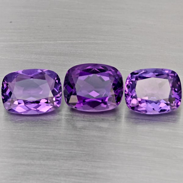 Natural Purple Amethyst Gemstones 10.47 Ct. 3 Pcs. Cushion Shape 11 x 8.5 Mm.: Product ID: 800325634 Product Name: Natural Amethyst Weight: 10.47 CT. Size: 11 x 8.5 x 5 to 10.4 x 8.5 x 6 MM. Shape: Cushion Shape Color: Purple Clarity:VVS Luster: Very Good Gems Origin: Brazil Tre