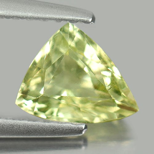 Natural Yellowish Green Chrysoberyl Gemstones 1.03 Ct. Trilliant Shape 6.9 x 5.9 Mm.: Product ID: 801701097 Product Name: Natural Chrysoberyl Weight: 1.03 CT. Size: 6.9 x 5.9 x 3.5 MM. Shape: Trilliant Color: Yellow Clarity:VSI Luster: Good Gems Origin: Madagascar Treatment: Unheated C
