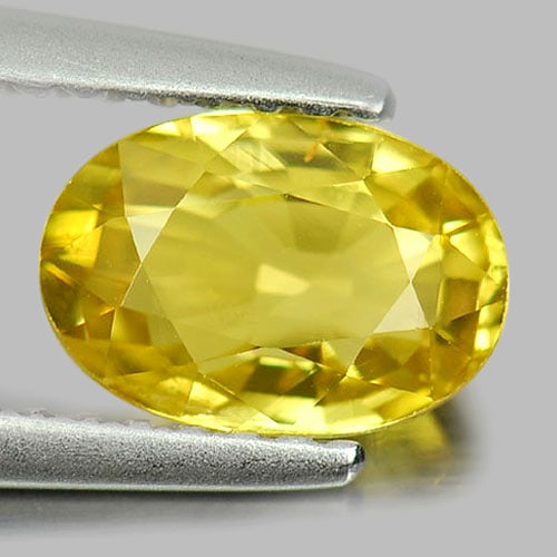 Natural Yellow Chrysoberyl Gemstones 1.31 Ct. Oval Shape 7.8 x 5.2 Mm.: Product ID: 801701092 Product Name: Natural Chrysoberyl Weight: 1.31 CT. Size: 7.8 x 5.2 x 3.5 MM. Shape: Oval Color: Yellow Clarity:VSI Luster: Good Gems Origin: Madagascar Treatment: Unheated Crysta