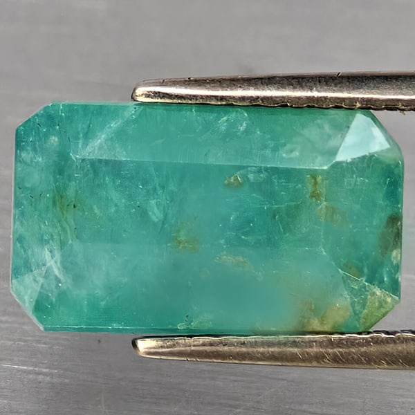 Natural Green Blueish Grandidierite Gemstones 4.44 Ct. Octagon Shape 12.5 x 7.5 Mm.: Product ID: 803100067 Product Name: Natural Tsavorite Weight: 4.44 CT. Size: 12.5 x 7.5 x 5.6 MM. Shape: Octagon Color: Green Blueish Clarity:SI1 Luster: Good Gems Origin: Madagascar Treatment: Unheat