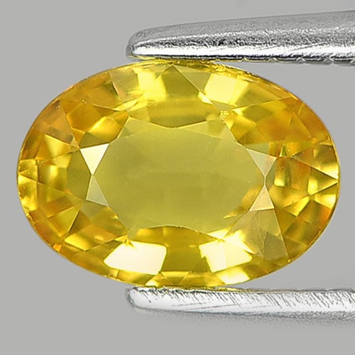 Natural Yellow Sapphire Gemstones 0.98 Ct. Oval Shape 7 x 5 Mm.: Product ID: 806150907 Product Name: Natural Yellow Sapphire Weight: 0.98 CT. Size: 7 x 5 x 3 MM. Shape: Oval Color: Yellow Clarity:VSI Luster: Very Good Gems Origin: Thailand Treatment: Heated Crystal