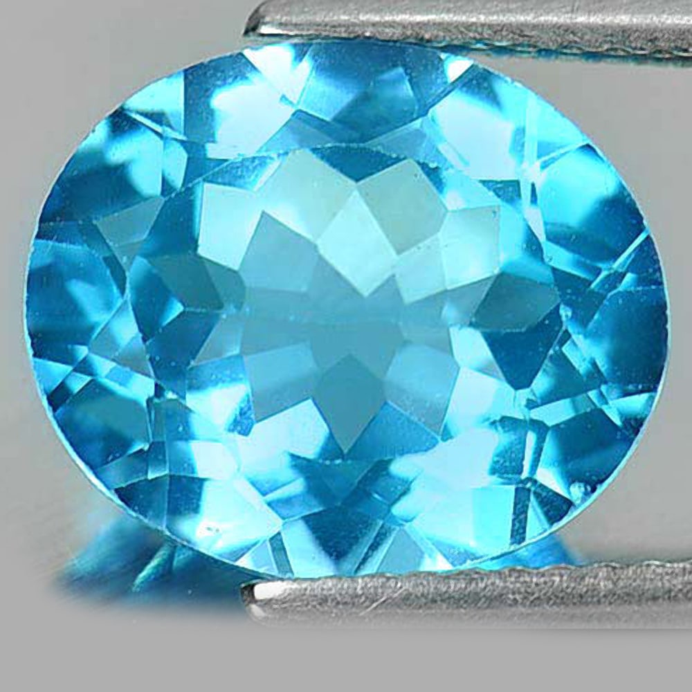 Natural Swiss Blue Topaz Gemstones 5.37 Ct. Oval Shape 12 x 10 Mm.: Product ID: 807161116 Product Name: Natural Blue Topaz Weight: 5.37 CT. Size: 12 x 10 x 6 MM. Shape: Oval Color: Blue Clarity:VSI Luster: Very Good Gems Origin: Brazil Treatment: Treated Crystal Struc
