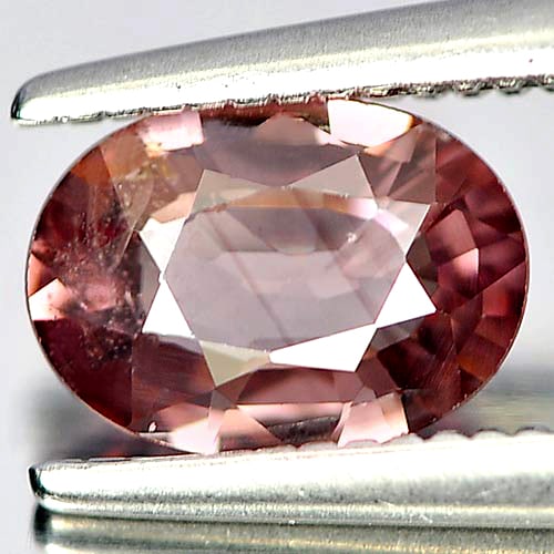 Natural Brownish Pink Zircon Gemstones 0.88 Ct. Oval Shape 7.1 x 5.2 Mm.: Product ID: 807730596 Product Name: Natural Zircon Weight: 0.88 CT. Size: 7.1 x 5.2 x 2.3 MM. Shape: Oval Color: Brownish Pink Clarity:SI1 Luster: Good Gems Origin: Cambodia Treatment: Heated Crystal 