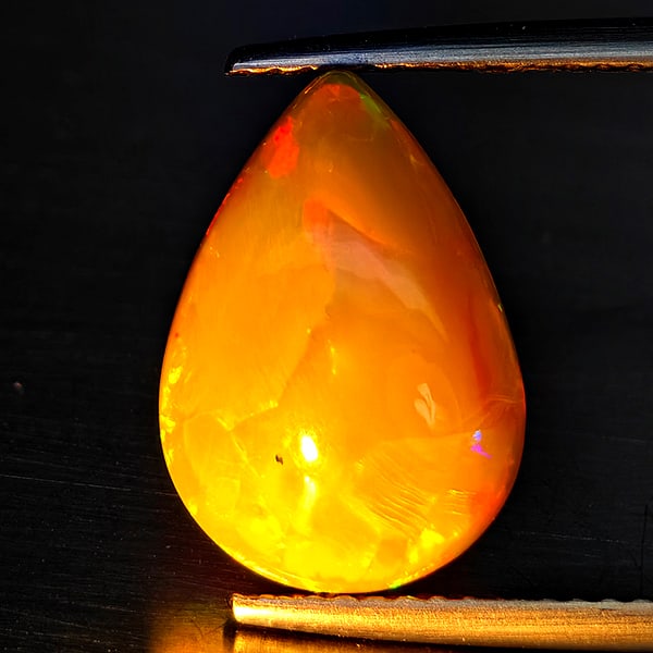 Natural Multi Color Opal Gemstones 2.27 Ct. Pear Cabochon Shape 14.3 x 10.1 Mm.: Product ID: 708700043 Product Name: Natural Weight: 2.27 CT. Size: 14.3 x 10.1 x 5 MM. Shape: Pear Cabochon Color: Multi-Color Clarity:Semi - Transparent Luster: Iridescent Gems Origin: Ethiopia Treat
