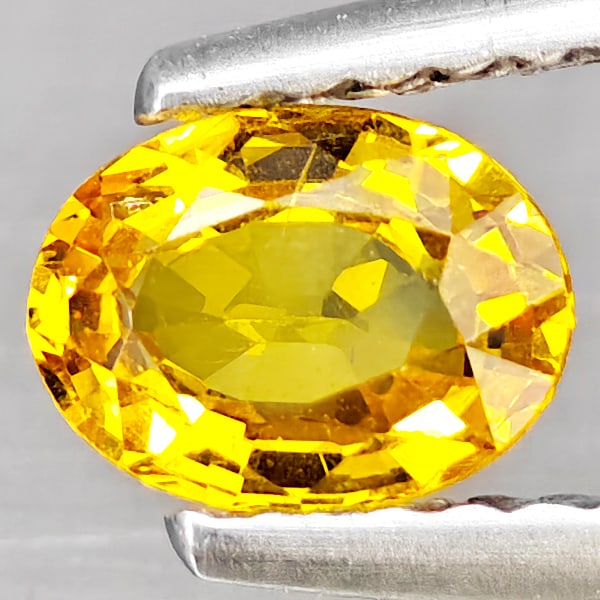 Natural Yellow Sapphire Gemstones 0.59 Ct. Oval Shape 6 x 4.6 Mm.: Product ID: 806163026 Product Name: Natural Yellow Sapphire Weight: 0.59 CT. Size: 6 x 4.6 x 2.8 MM. Shape: Oval Color: Yellow Clarity:VSI Luster: Good Gems Origin: Thailand Treatment: Heated Crystal 