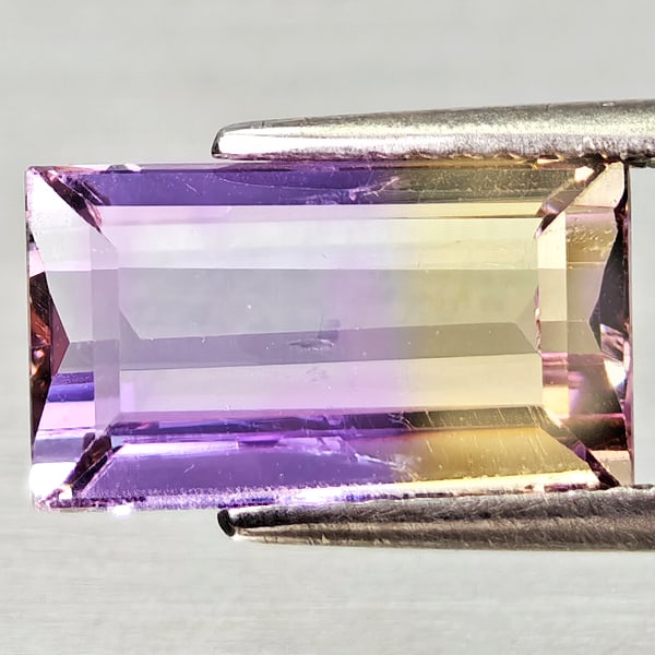 Natural Bi Color Ametrine Gemstones 3.26 Ct. Baguette Shape 11.9 x 6.9 Mm.: Product ID: 800408215 Product Name: Natural Ametrine Weight: 3.26 CT. Size: 11.9 x 6.9 x 5 MM. Shape: Baguette Color: Bi Color Clarity:VSI Luster: Very Good Gems Origin: Bolivia Treatment: Unheated Cr
