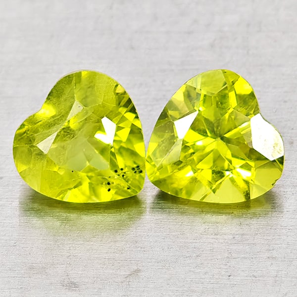 Natural Green Peridot Gemstones 1.79 Ct. 2 Pcs. Heart Shape 6 x 6 Mm.: Product ID: 805317317 Product Name: Natural Peridot Weight: 1.79 CT. Size: 6 x 6 x 3.9 MM. Shape: Heart Shape Color: Green Clarity:VSI - SI1 Luster: Good Gems Origin: Pakistan Treatment: Unheated Crys