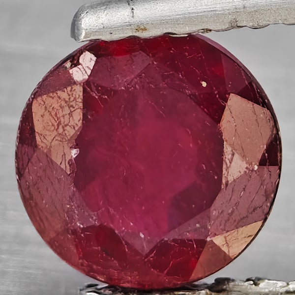 Natural Pinkish Red Ruby Gemstones 1.23 Ct. Round Shape 6.4 Mm.: Product ID: 805935899 Product Name: Natural Ruby Weight: 1.23 CT. Size: 6.4 x 6.4 x 3.8 MM. Shape: Round Color: Pinkish Red Clarity:SI1 Luster: Good Gems Origin: Madagascar Treatment: Heated (Lead-gla