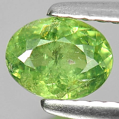 Natural Green Demantoid Garnet Gemstones 0.82 Ct. Oval Shape 6.3 x 4.8 Mm.: Product ID: 802919289 Product Name: Natural Demantoid Weight: 0.82 CT. Size: 6.3 x 4.8 x 3.3 MM. Shape: Oval Color: Green Clarity:SI Luster: Good Gems Origin: Madagascar , Africa Treatment: Unheated C