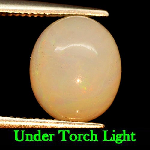 Natural Multi Color Play Of Colour Opal Gemstones 2.48 Ct. Oval Cabochon Shape 10.3 x 8.8 Mm.: Product ID: 818725795 Product Name: Natural Opal Weight: 2.48 CT. Size: 10.3 x 8.8 x 5.4 MM. Shape: Oval Cabochon Color: Multi Color Clarity:Semi - Transparent Luster: Iridescent Gems Origin: Ethiopia