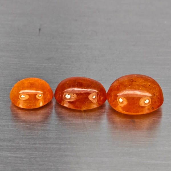 Natural Orangish Red Spessartine Garnet Gemstones 12.02 Ct. 3 Pcs. Oval Cabochon Shape: Product ID: 802937995 Product Name: Natural Garnet Weight: 12.02 CT. Size: 10.1 x 9.1 x 6.1 to 8 x 7 x 4.5 MM. Shape: Oval Cabochon Color: Orangish Red Clarity:SI1 Luster: Good Gems Origin: Namibia Tr