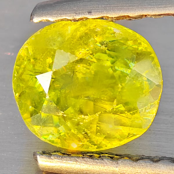 Natural Multi-Color Sphene Gemstones With Rainbow Spark 1.11 Ct. Oval Shape 6.5 x 5.8 Mm.: Product ID: 806509162 Product Name: Natural Sphene Weight: 1.11 CT. Size: 6.5 x 5.8 x 4.3 MM. Shape: Oval Shape Color: Multi-Color With Rainbow Spark Clarity:SI1 Luster: Good Gems Origin: Madagascar T