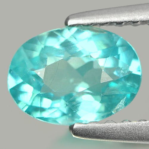 Natural Paraiba Color Apatite Gemstones 0.83 Ct. Oval Shape 7 x 5.2 Mm.: Product ID: 800606298 Product Name: Natural Apatite Weight: 0.83 CT. Size: 7 x 5.2 x 3.4 MM. Shape: Oval Color: Neon Blue Clarity:SI Luster: Good Gems Origin: Tanzania Treatment: Unheated Crystal Stru