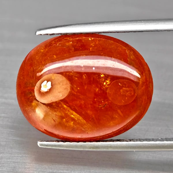 Natural Orangish Red Spessartine Garnet Gemstones 18.11 Ct. Oval Cabochon Shape 17.6 x 14 Mm.: Product ID: 802938041 Product Name: Natural Garnet Weight: 18.11 CT. Size: 17.6 x 14 x 7.1 MM. Shape: Oval Cabochon Color: Orangish Red Clarity:SI1 Luster: Good Gems Origin: Namibia Treatment: Unheate