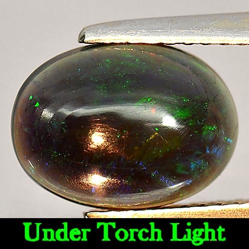 Natural Play Of Color Rainbow Fire Red Black Opal Gemstones 1.52 Ct. Oval Cabochon Shape 10.8 x 8: Product ID: 818724268 Product Name: Natural Opal Weight: 1.52 CT. Size: 10.8 x 8 x 3.6 MM. Shape: Oval Cabochon Color: Multi-Color Clarity:Semi - Transparent Luster: Iridescent Gems Origin: Ethiopia T