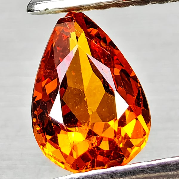 Natural Orangish Red Spessartine Garnet Gemstones 0.96 Ct. Pear Shape 7.2 x 5 Mm.: Product ID: 802936806 Product Name: Natural Spessartine Weight: 0.96 CT. Size: 7.2 x 5 x 3.2 MM. Shape: Pear Shape Color: Orangish Red Clarity:VSI Luster: Good Gems Origin: Namibia,Africa Treatment: U