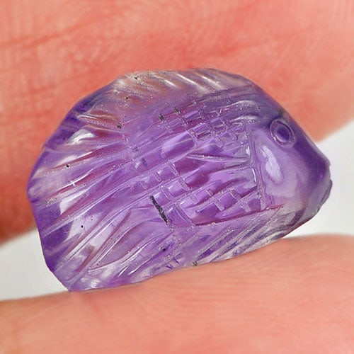 Natural Purple Amethyst Gemstones 5.73 Ct. Fish Carving Shape 15.5 x 11.1 Mm.: Product ID: 810303432 Product Name: Natural Amethyst Weight: 5.73 CT. Size: 15.5 x 11.1 x 6.3 MM. Shape: Fish Carving Color: Purple Clarity:Semi - Transparent Luster: Good Gems Origin: Brazil Treatmen