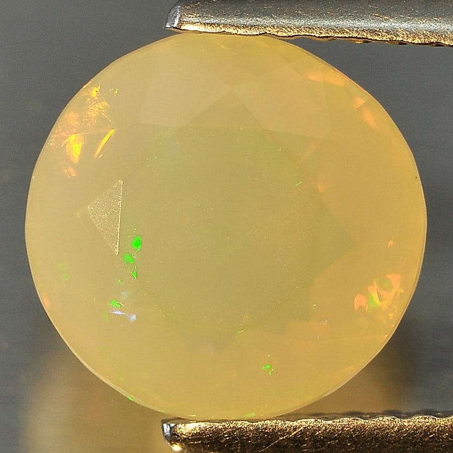 Natural Muti Color Opal Gemstones 1.73 Ct. Round Shape 8.8 Mm.: Product ID: 818715459 Product Name: Natural Opal Weight: 1.73 CT. Size: 8.8 x 8.8 x 5.5 MM. Shape: Round Color: Muti Color Clarity:Semi - Transparent Luster: Good Gems Origin: Ethiopia Treatment: Unhe