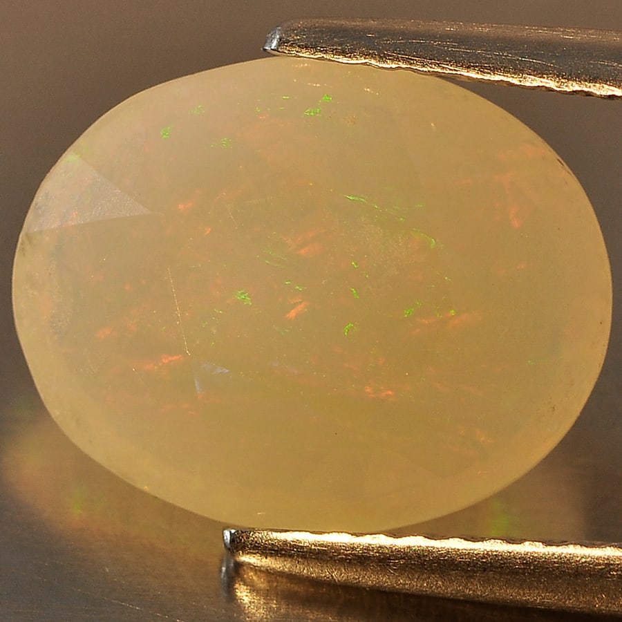 Natural Multi Color Opal Gemstones 2.94 Ct. Oval Shape 12.8 x 10.3 Mm.: Product ID: 818711135 Product Name: Natural Opal Weight: 2.94 CT. Size: 12.8 x 10.3 x 5.2 MM. Shape: Oval Color: Multi Color Clarity:Semi - Transparent Luster: Good Gems Origin: Ethiopia Treatment: Un