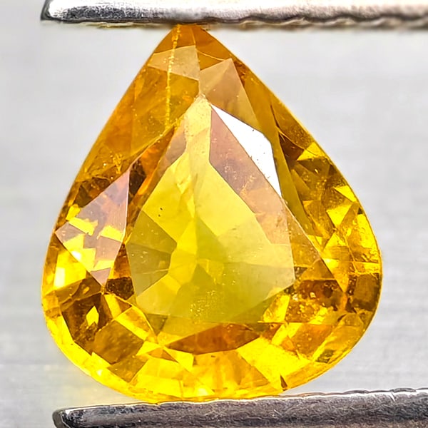 Natural Yellow Sapphire Gemstones 1.26 Ct. Pear Shape 7.4 x 6.5 Mm.: Product ID: 806162579 Product Name: Natural Yellow Sapphire Weight: 1.26 CT. Size: 7.4 x 6.5 x 3.4 MM. Shape: Pear Shape Color: Yellow Clarity:VSI - SI1 Luster: Good Gems Origin: Thailand Treatment: T