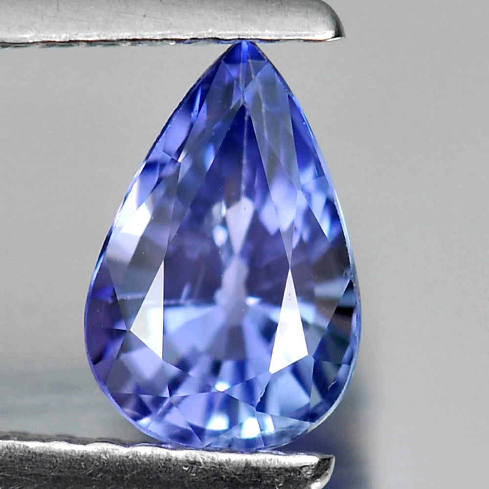 Natural Blue Tanzanite Gemstones 1.07 Ct. Pear Shape 7.7 x 5.1 Mm.: Product ID: 807009134 Product Name: Natural Tanzanite Weight: 1.07 CT. Size: 7.7 x 5.1 x 4.1 MM. Shape: Pear Color: Violet Blue Clarity:VVS Luster: Good Gems Origin: Tanzania Treatment: Heated Crystal
