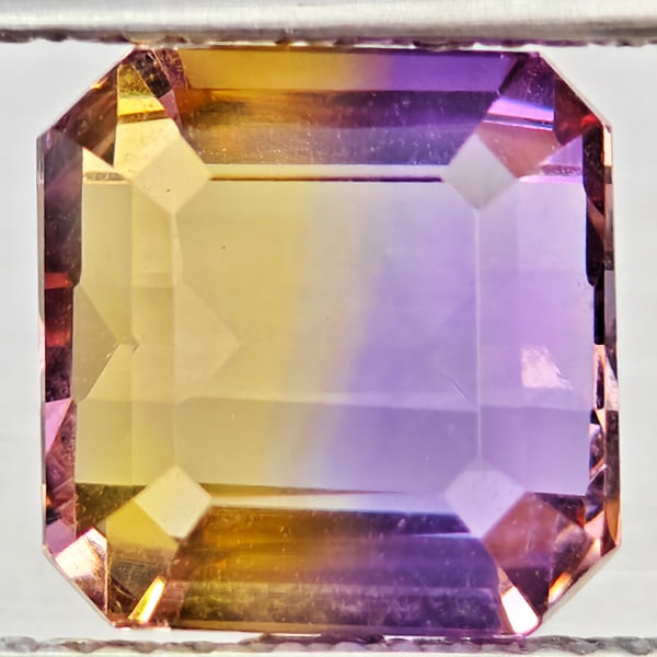 Natural Bi Color Ametrine Gemstones 4.53 Ct. Octagon Shape 8.6 x 8.6 Mm.: Product ID: 800408583 Product Name: Natural Ametrine Weight: 4.53 CT. Size: 8.6 x 8.6 x 6.2 MM. Shape: Octagon Color: Bi Color Clarity:VSI Luster: Good Gems Origin: Bolivia Treatment: Unheated Crystal