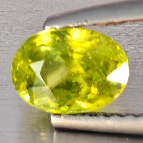 Natural Multi-Color With Rainbow Spark Sphene Gemstones 0.94 Ct. Oval Shape 7 x 5.1 Mm.: Product ID: 806509151 Product Name: Natural Sphene Weight: 0.94 CT. Size: 7 x 5.1 x 3.5 MM. Shape: Oval Shape Color: Multi-Color With Rainbow Spark Clarity:SI1 Luster: Good Gems Origin: Madagascar Tre