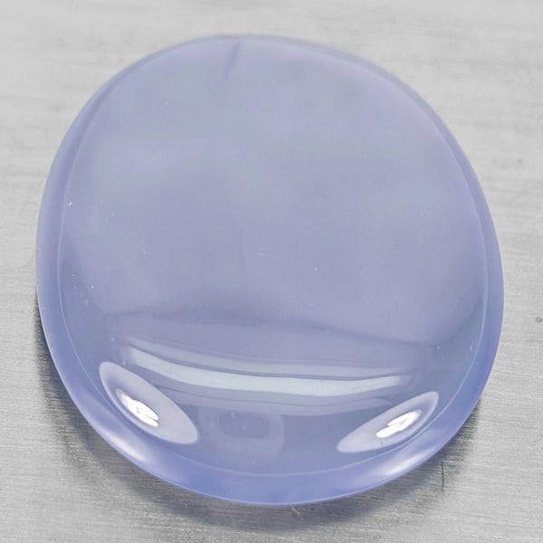 Natural Lavender Chalcedony Gemstones 41.77 Ct. Oval Cabochon Shape 29 x 24 Mm.: Product ID: 801502640 Product Name: Natural Weight: 41.77 CT. Size: 29 x 24 x 8.4 MM. Shape: Oval Cabochon Color: Lavender Clarity:Semi - Transparent Luster: Good Gems Origin: Russia Treatment: Unheat