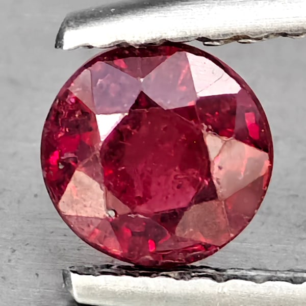 ATTRACTIVE GEM NATURAL RED RUBY MADAGASCAR: Product ID: 105901589 Product Name: Natural Ruby Weight: 0.92 CT. Size: 5.2 X 5.2 X 3.9 MM. Shape: ROUND Color: RED Clarity:SI1 Luster: GOOD Gems Origin: MADAGASCAR Treatment: Heated (Lead-glass filli