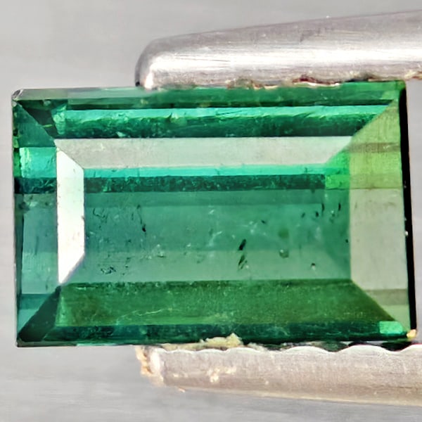 Natural Green Tourmaline Gemstones 0.66 Ct. Baguette Shape 5.9 x 3.7 Mm.: Product ID: 807251178 Product Name: Natural Tourmaline Weight: 0.66 CT. Size: 5.9 x 3.7 x 3.2 MM. Shape: Baguette Color: Green Clarity:SI1 Luster: Good Gems Origin: Nigeria Treatment: Unheated Crystal