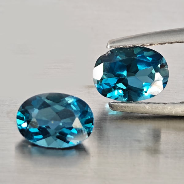Natural London Blue Topaz Gemstones 1.89 Ct. 2 Pcs. Oval Shape 7.2 x 5.2 Mm.: Product ID: 807169109 Product Name: Natural Blue Topaz Weight: 1.89 CT. Size: 7.2 x 5.2 x 3.3 MM. Shape: Oval Shape Color: London Blue Clarity:VSI - SI1 Luster: Good Gems Origin: Brazil Treatment: Tre