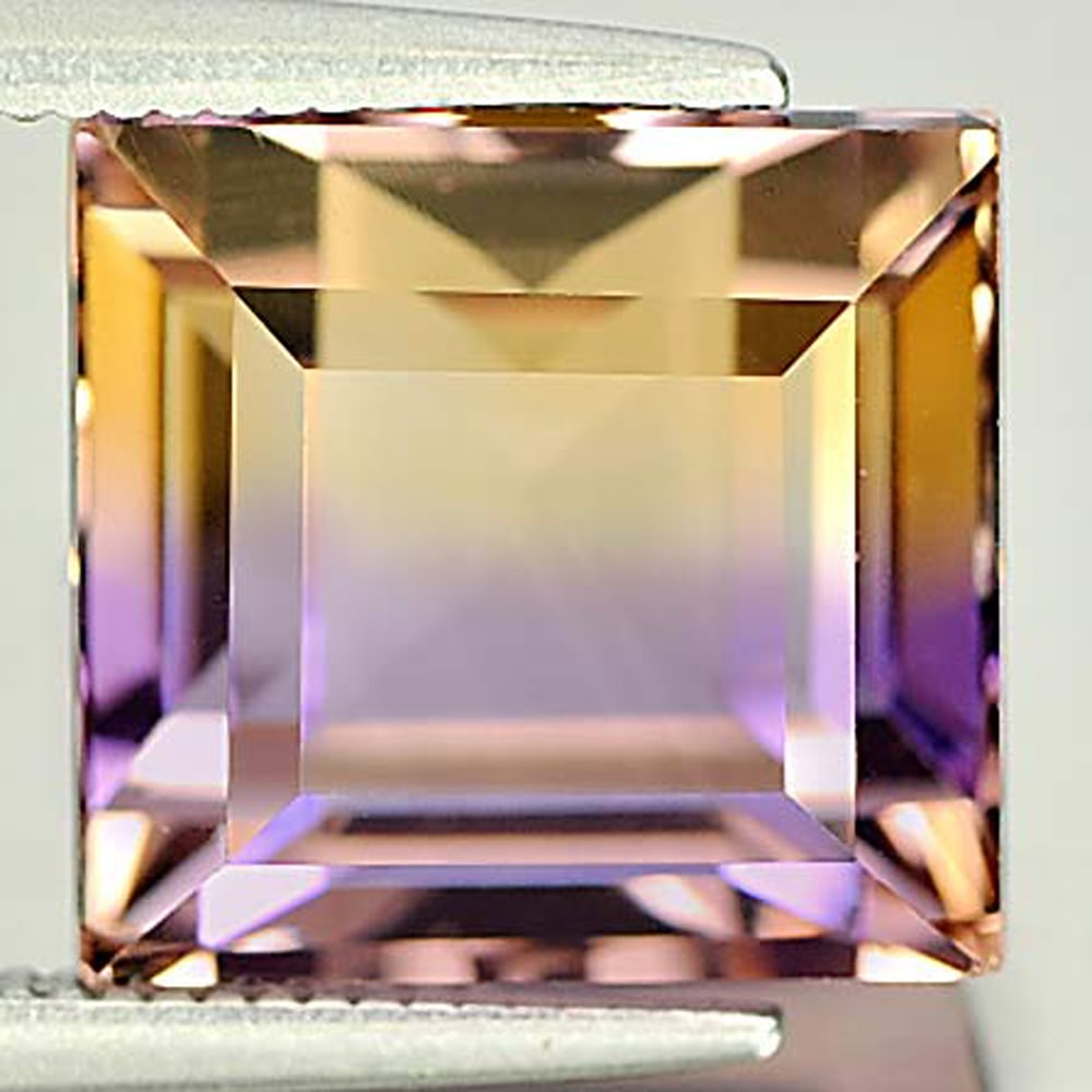 Natural Bi Color Ametrine Gemstones 8.55 Ct. Baguette 10.9 x 10.3 Mm.: Product ID: 800407323 Product Name: Natural Ametrine Weight: 8.55 CT. Size: 10.9 x 10.3 x 9.1 MM. Shape: Baguette Color: Bi-Color Clarity:VSI Luster: Good Gems Origin: Bolivia Treatment: Unheated Crys