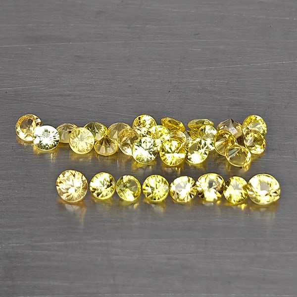Natural Yellow Songea Sapphire Gemstones 0.96 Ct. 31 Pcs. Round Diamond Cut and Mixed Size: Product ID: 806130590 Product Name: Natural Fancy Color Sapphire Weight: 0.96 CT. Size: 2 x 2 x 1.4 to 1.7 x 1.7 x 1.2 MM. Shape: Round Diamond Cut Color: Yellow Clarity:VSI - SI1 Luster: Good Gems Or