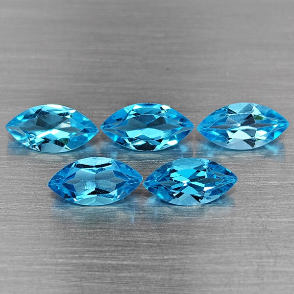 Natural Swiss Blue Topaz Gemstones 5.96 Ct. 5 Pcs. Marquise Shape 10 x 4.9 Mm.: Product ID: 807168711 Product Name: Natural Blue Topaz Weight: 5.96 CT. Size: 10 x 4.9 x 3.5 MM. Shape: Marquise Shape Color: Swiss Blue Clarity:VSI Luster: Good Gems Origin: Brazil Treatment: Treated