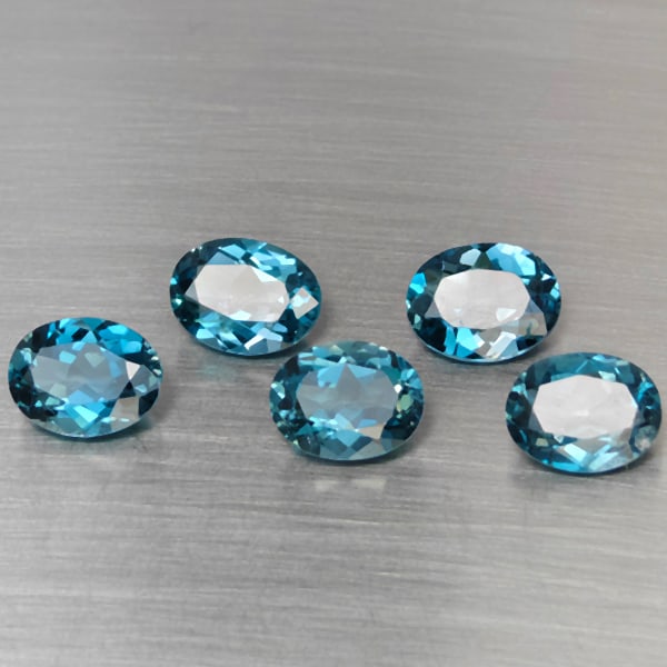Natural London Blue Topaz Gemstones 10.19 Ct 5 Pcs. Oval Shape 9.1 x 7 Mm.: Product ID: 807168958 Product Name: Natural Blue Topaz Weight: 10.19 CT. Size: 9.1 x 7 x 4.4 MM. Shape: Oval Color: London Blue Clarity:SI1 Luster: Good Gems Origin: Brazil Treatment: Treated Crystal 