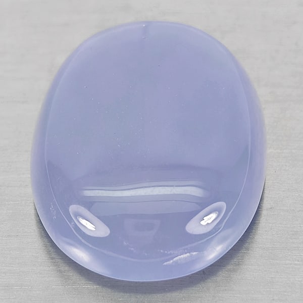 Natural Lavender Chalcedony Gemstones 37.22 Ct. Oval Cabochon Shape 27 x 20 Mm.: Product ID: 801502676 Product Name: Natural Chalcedony Weight: 37.22 CT. Size: 27 x 20 x 8.9 MM. Shape: Oval Cabochon Color: Lavender Clarity:Semi - Transparent Luster: Good Gems Origin: Russia Treatm