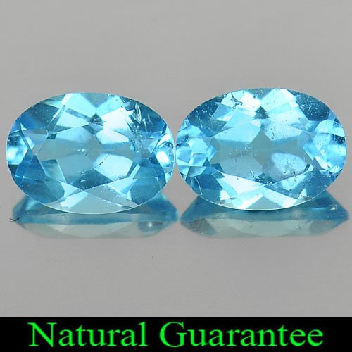 Natural Swiss Blue Topaz Gemstones 1.91 Ct. 2 Pcs. Oval Shape 7 x 5 Mm.: Product ID: 807163930 Product Name: Natural Blue Topaz Weight: 1.91 CT. Size: 7 x 5 x 3.4 MM. Shape: Oval Color: Swiss Blue Clarity:VSI Luster: Good Gems Origin: Brazil Treatment: Treated Crystal Stru