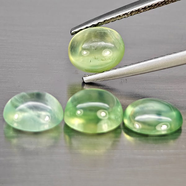 Natural Green Prehnite Gemstones 5.23 Ct. 4 Pcs. Oval Cabochon Shape: Product ID: 818802949 Product Name: Natural Prehnite Weight: 5.23 CT. Size: 7.5 x 6.3 x 3.1 to 7.3 x 6.1 x 4.6 MM. Shape: Oval Cabochon Color: Green Clarity:Semi - Transparent Luster: Good Gems Origin