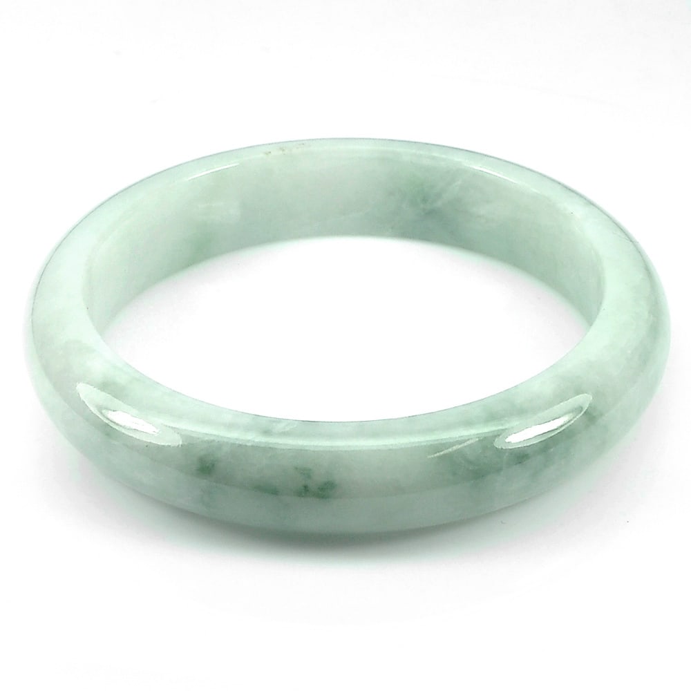 Natural Green White Jade Gemstones 288.27 Ct. Bangle Diameter 59 Mm.: Product ID: 819813247 Product Name: Natural Jade Weight: 288.27 CT. Size: 74 x 59 x 14 MM. Shape: Round Cabcohon Color: Green Clarity:Opaque Luster: Good Gems Origin: Thailand Treatment: Unheated Crys