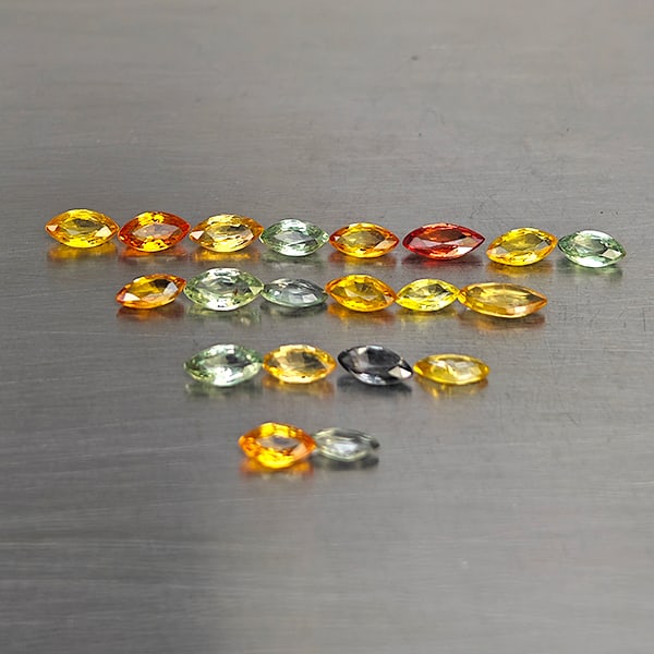 Natural Fancy Color Songea Sapphire 2.30 Ct. 20 Pcs. Marquise Shape and Mixed Size: Product ID: 806130581 Product Name: Natural Sapphire Weight: 2.30 CT. Size: 5.1 x 2.4 x 1.5 to 4 x 2.2 x 1.6 MM. Shape: Marquise Shape Color: Fancy Color Clarity:VSI Luster: Good Gems Origin: Tanzania