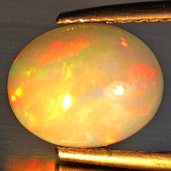 Natural Multi-Color Play Of Colour Opal Gemstone 1.63 Ct. Oval Cabochon Shape 10 x 8.3 Mm. (1 of 3)