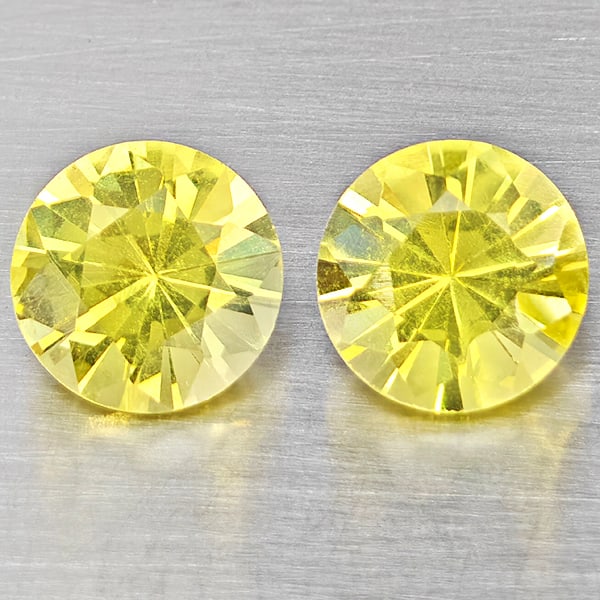 Natural Yellow Lemon Quartz Gemstones 3.57 Ct. 2 Pcs. Round Diamond Cut 8.2 Mm.: Product ID: 805530204 Product Name: Natural Quartz Weight: 3.57 CT. Size: 8.2 x 8.2 x 5.7 MM. Shape: Round Diamond Cut Color: Yellow Lemon Clarity:VSI Luster: Good Gems Origin: Brazil Treatment: Unhea