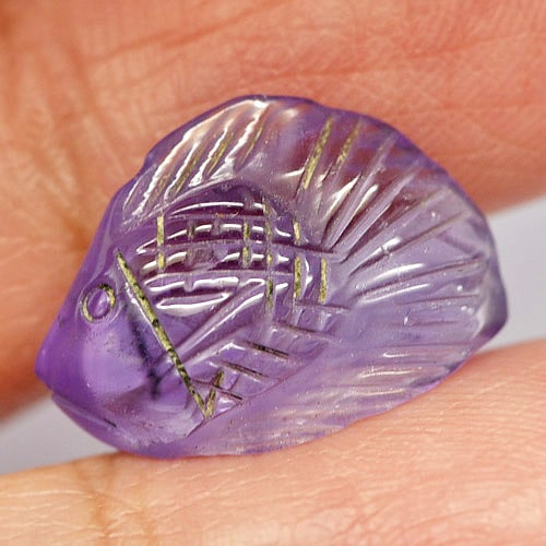 Natural Purple Amethyst Gemstones 7.73 Ct. Fish Carving Shape 17.4 x 11.9 Mm.: Product ID: 810303455 Product Name: Natural Amethyst Weight: 7.73 CT. Size: 17.4 x 11.9 x 7 MM. Shape: Fish Carving Color: Purple Clarity:Semi - Transparent Luster: Good Gems Origin: Brazil Treatment: